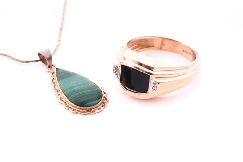 Lot 2 - A gents yellow metal and onyx ring, set with a...