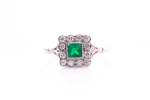 Lot 128 - A platinum, diamond, and emerald ring, set...