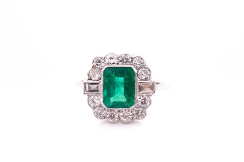 Lot 69 - A platinum, diamond, and emerald ring, set...