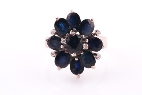 Lot 47 - A 1970's sapphire and diamond cluster ring,...