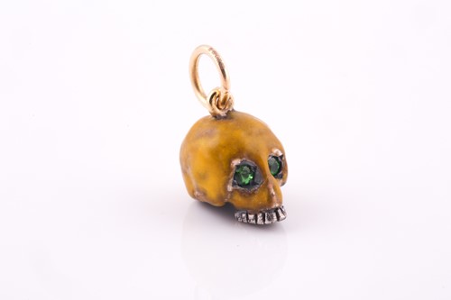 Lot 50 - An unusual enamel skull pendant, the silver...