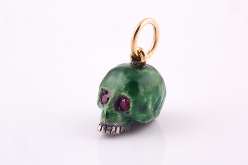 Lot 240 - A silver and green enamel skull pendant,...