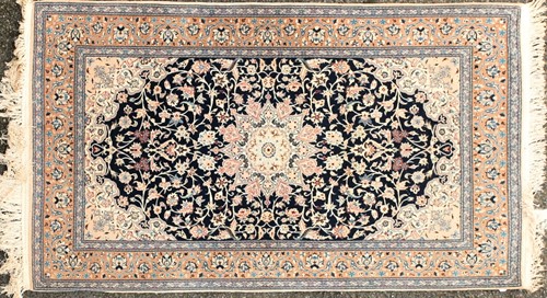 Lot 180 - A pair of Royal blue ground Kashan rug with...