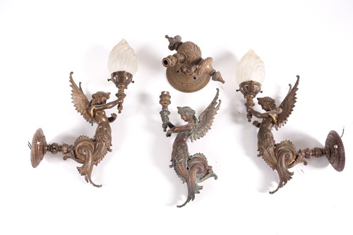 Lot 231 - A set of three bronze wall sconces, formed as...