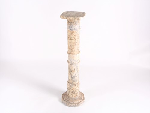 Lot 125 - An early 20th century turned white variegated...
