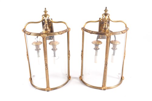 Lot 229 - A pair of gilt brass demi lune wall lights...