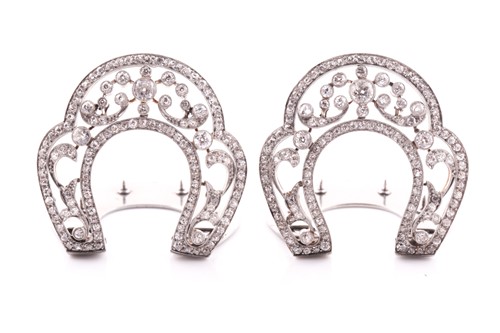 Lot 263 - A pair of diamond lapel clips, the horse-shoe...