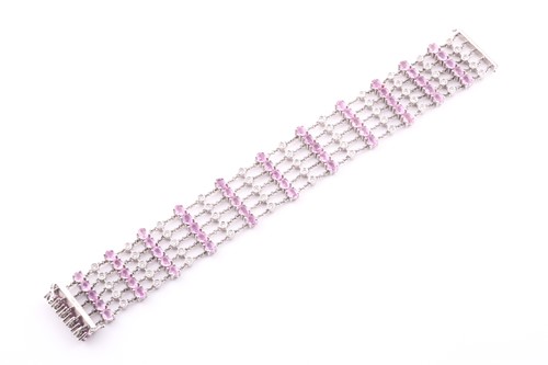 Lot 184 - An 18ct white gold, diamond, and pink sapphire...