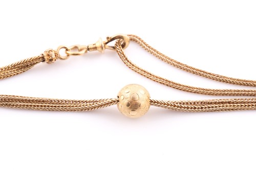 Lot 25 - A yellow metal rope-twist double strand muff...