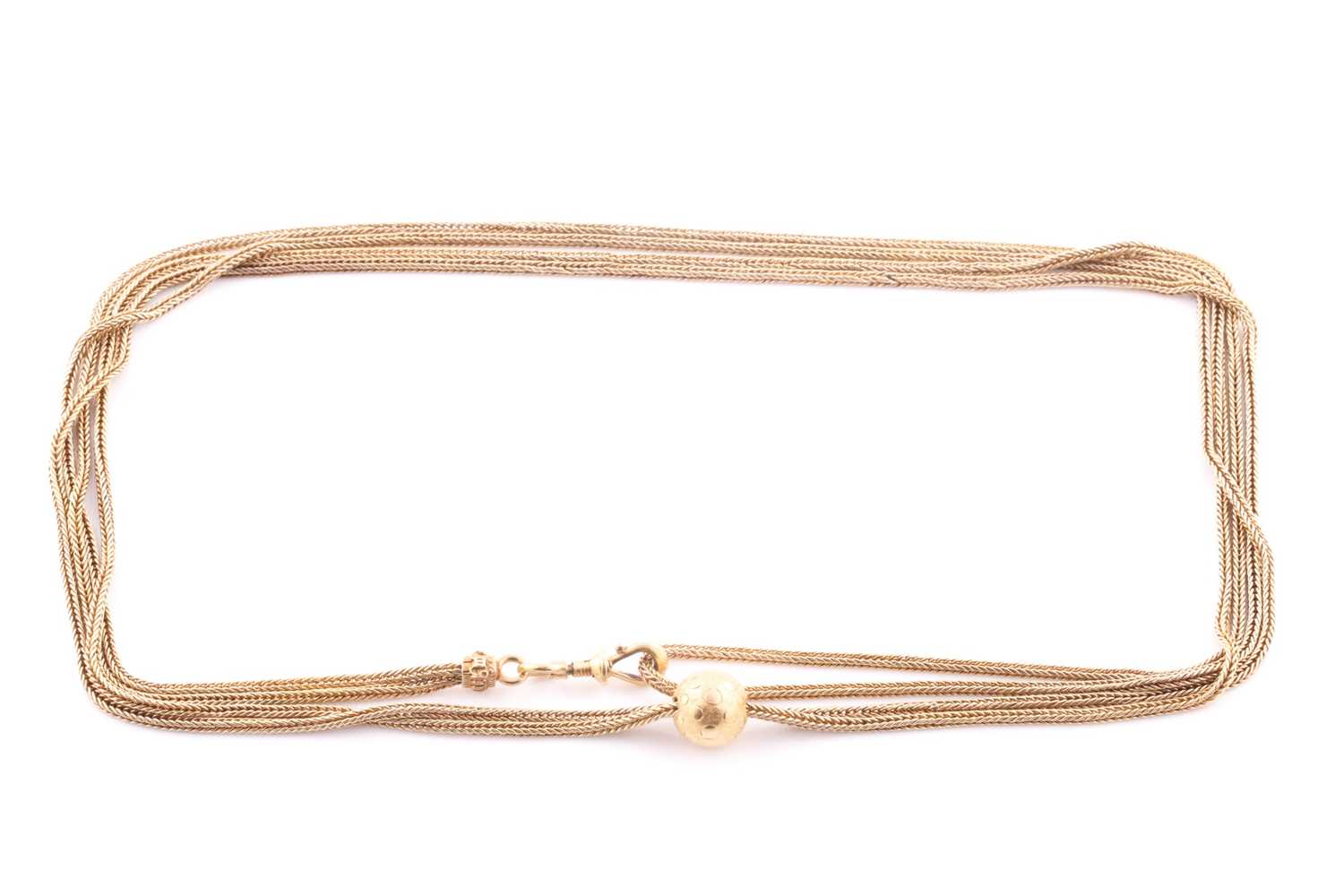 Lot 25 - A yellow metal rope-twist double strand muff...