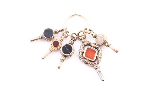 Lot 403 - A group of yellow metal pocket watch keys, set...