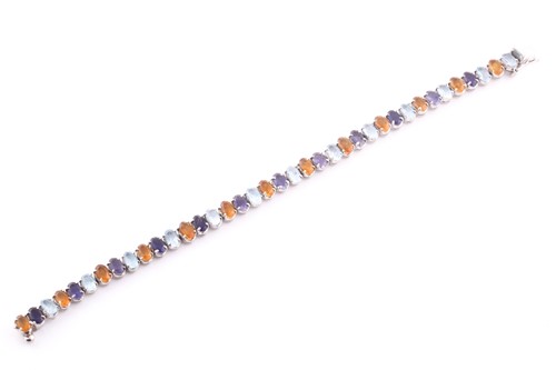 Lot 344 - A white metal and multi-gem set bracelet, set...