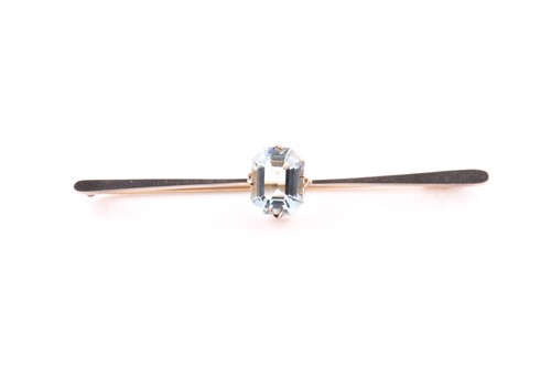 Lot 138 - A yellow metal bar brooch, set with a...