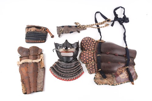 Lot 145 - A Japanese Me-No-Shita lacquered iron Menpo,...