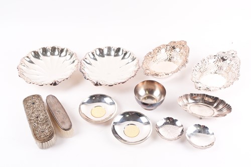 Lot 254 - A pair of early 20th-century silver boats form...