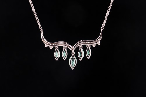 Lot 23 - An emerald and diamond necklace; the...