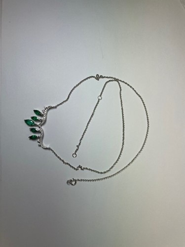 Lot 23 - An emerald and diamond necklace; the...