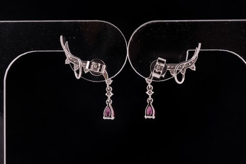 Lot 64 - A pair of ruby and diamond earrings; styled as...