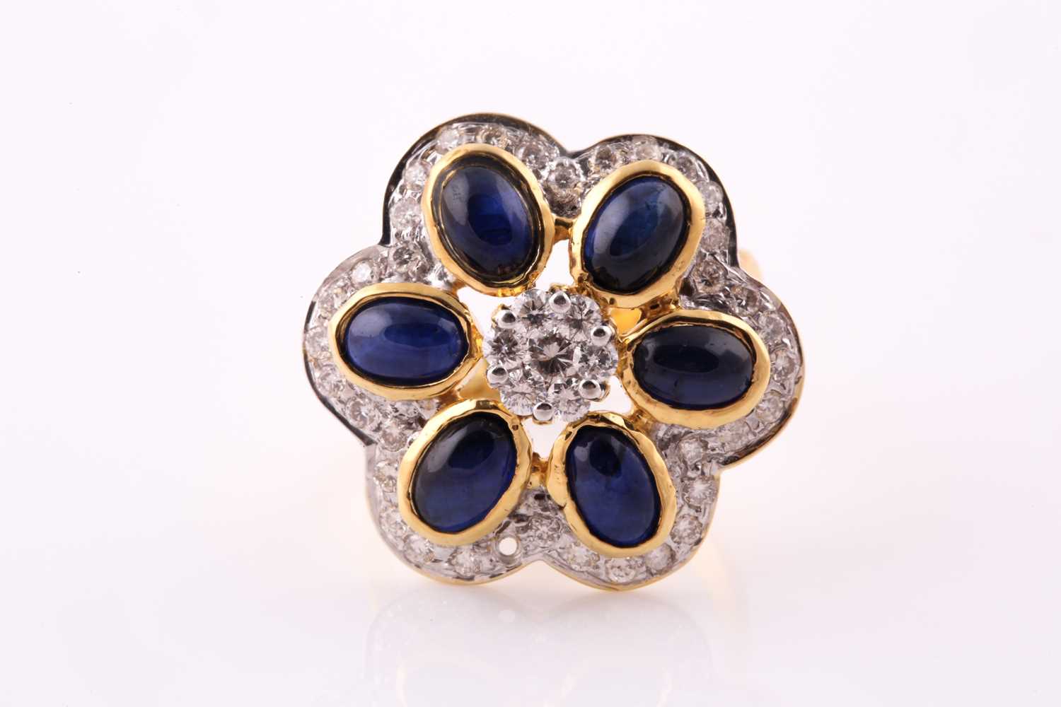 Lot 41 - A sapphire and diamond foliate cluster ring;...