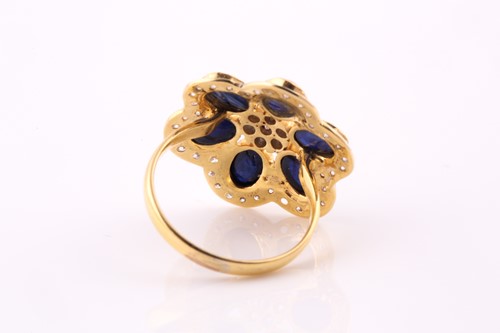 Lot 41 - A sapphire and diamond foliate cluster ring;...