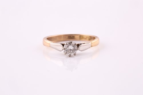Lot 135 - A diamond single stone ring. The round...