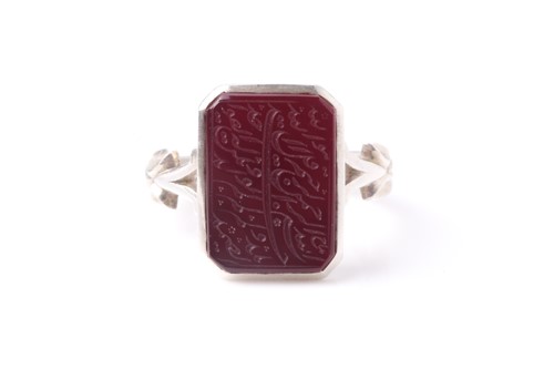 Lot 80 - An Eastern white metal gentleman's dress ring...