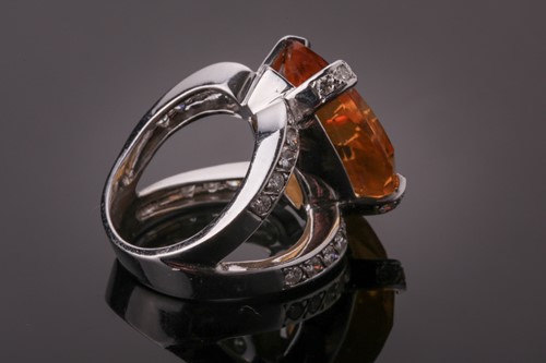 Lot 53 - A diamond and citrine cocktail ring, set with...