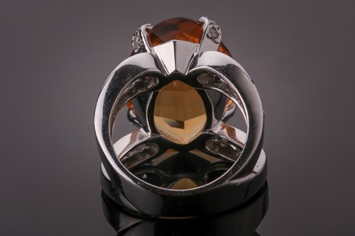 Lot 53 - A diamond and citrine cocktail ring, set with...