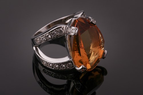 Lot 53 - A diamond and citrine cocktail ring, set with...