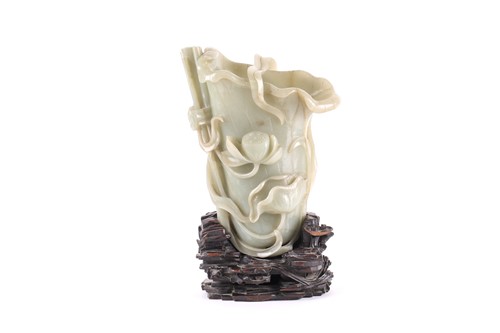 Lot 149 - A large Chinese carved celadon jade Rhyton,...