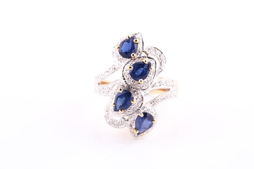 Lot 399 - An 18ct yellow gold, diamond, and blue...
