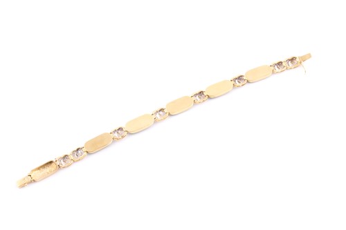 Lot 18 - An 18ct yellow gold, green jade, and diamond...