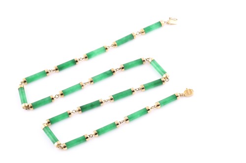 Lot 365 - A yellow metal and green jade necklace, with...