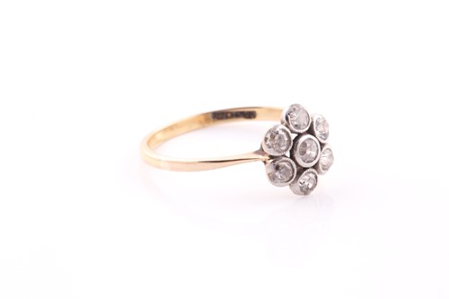Lot 29 - An 18ct yellow gold and diamond daisy cluster...
