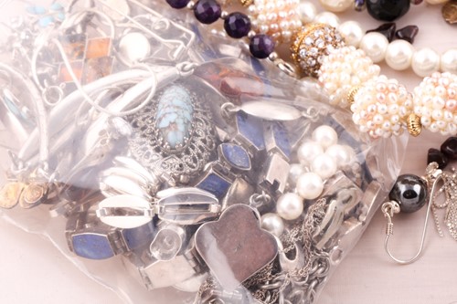 Lot 60 - A group of costume and silver jewellery,...