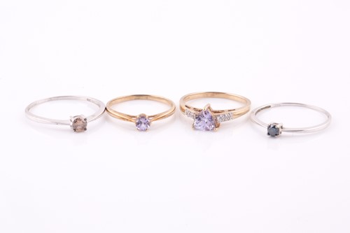 Lot 356 - A 9ct white gold and blue diamond ring, the...