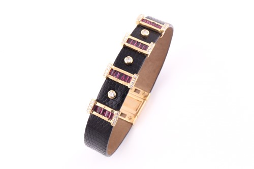 Lot 166 - A ruby, diamond and leather cuff bangle;...