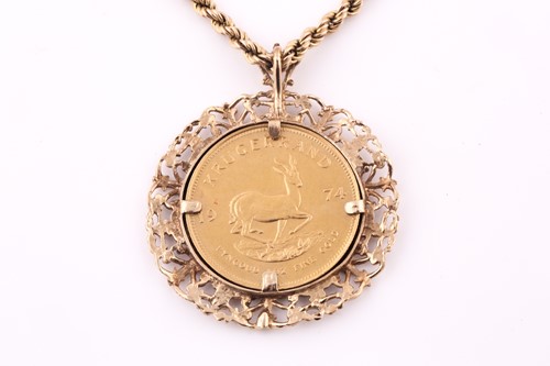 Lot 21 - A Krugerrand pendant and ropetwist chain; the...