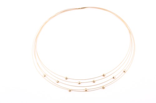 Lot 189 - A yellow metal collar necklace the five...