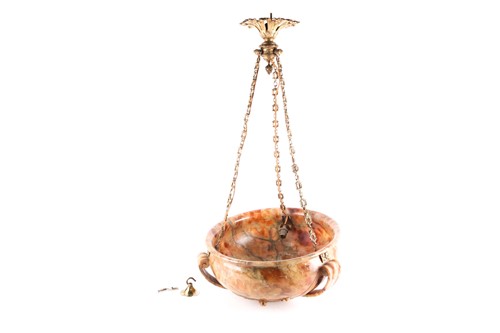 Lot 134 - An early 20th-century onyx plaffionier, with...