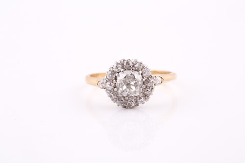 Lot 350 - A yellow metal and diamond cluster ring, set...