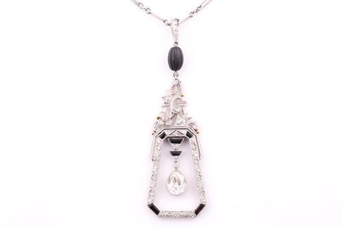 Lot 429 - An Art Deco diamond and onyx drop pendant, the...