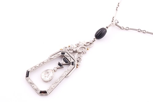 Lot 429 - An Art Deco diamond and onyx drop pendant, the...