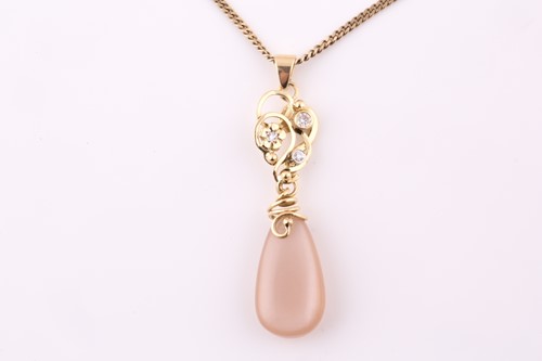 Lot 4 - A diamond and pear shape moonstone pendant, on...