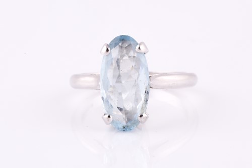 Lot 230 - 18ct white gold and aquamarine ring, four claw...