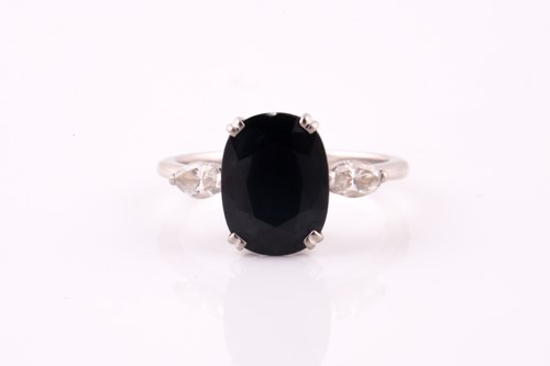 Lot 141 - A sapphire and diamond three stone ring, with...
