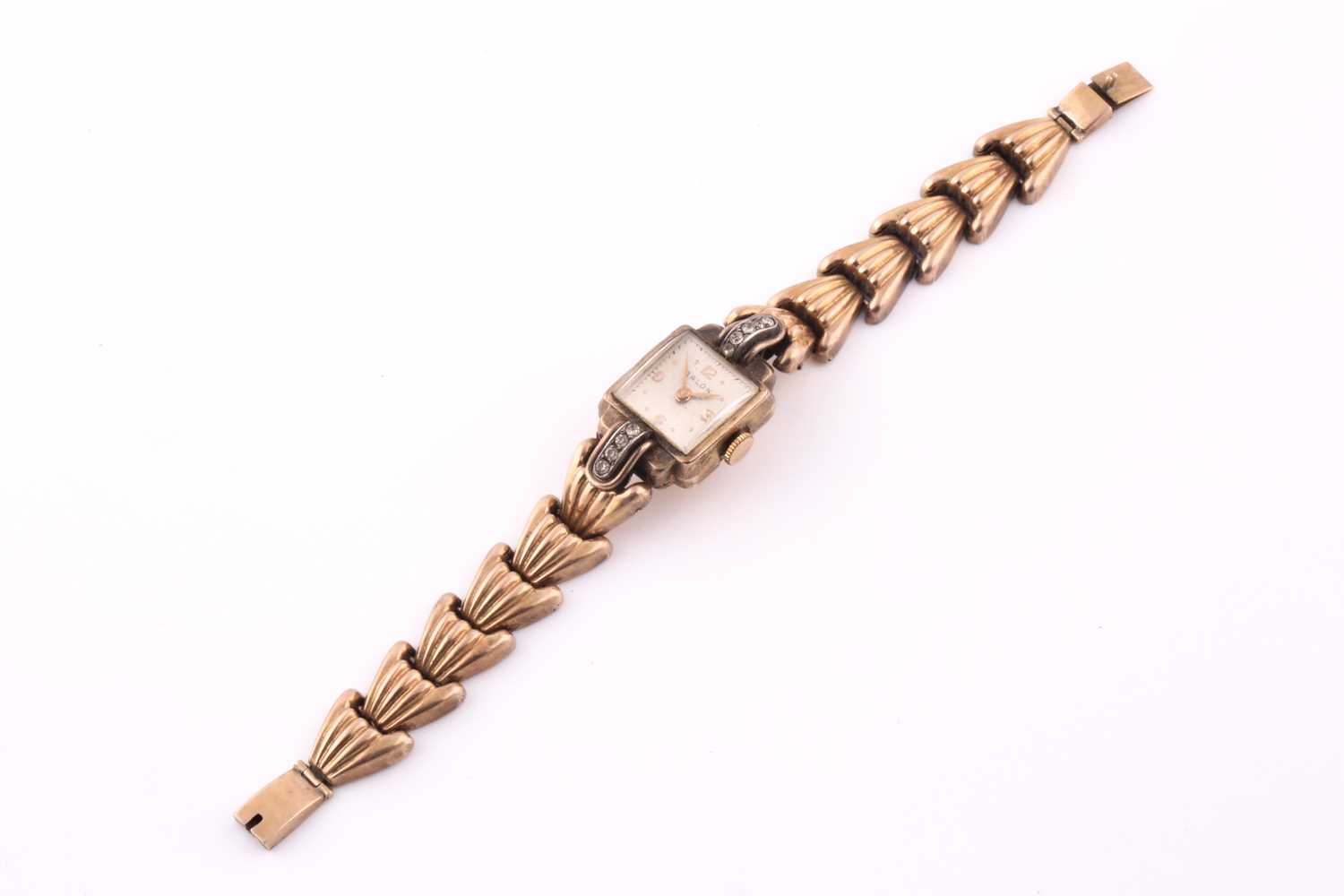 Lot 19 - A gold plated cocktail watch; the square...
