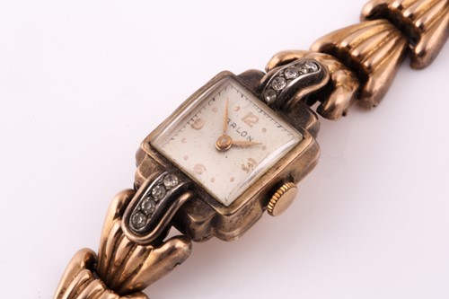 Lot 19 - A gold plated cocktail watch; the square...