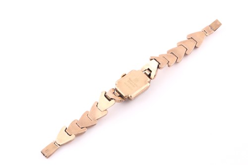 Lot 19 - A gold plated cocktail watch; the square...