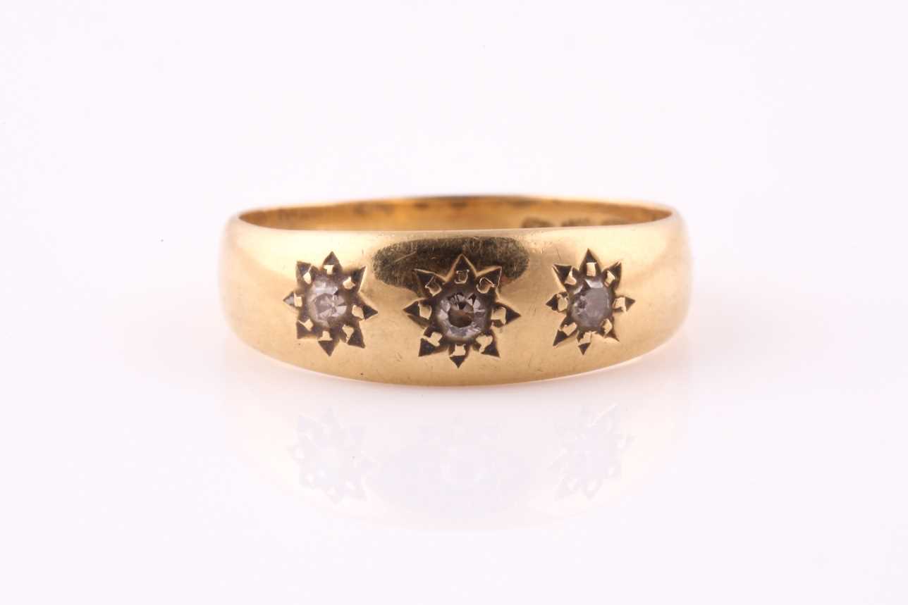 Lot 9 - An early 20th century three stone diamond...